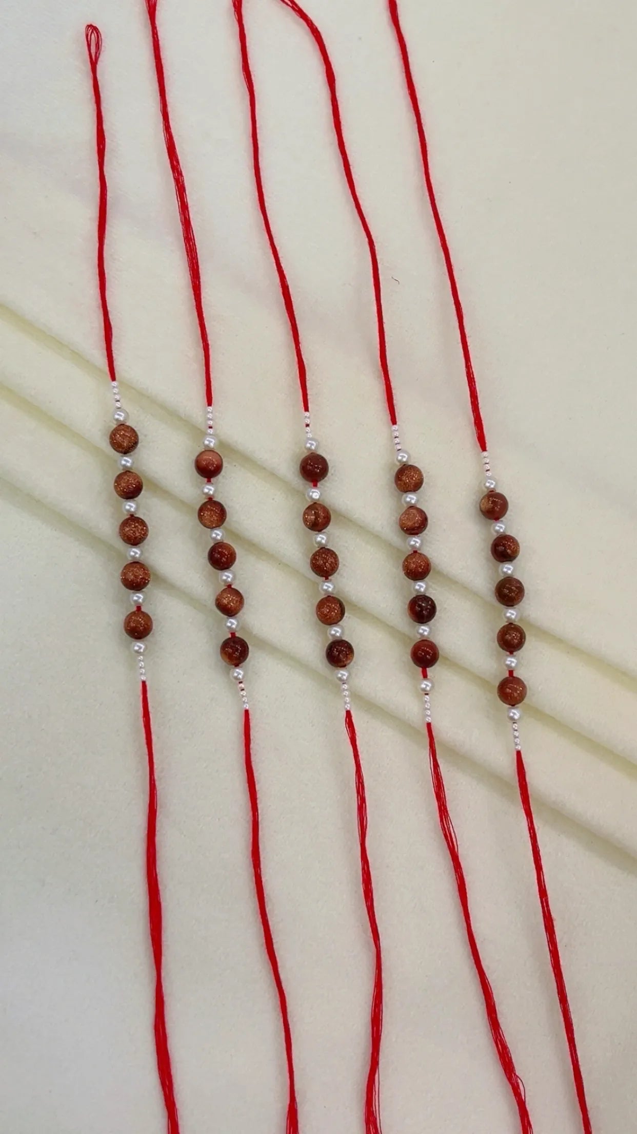 Natural Gemstone Rakhis for Health & Wealth – Pack of 5